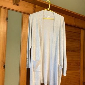 Lightweight cardigan with two front pockets.